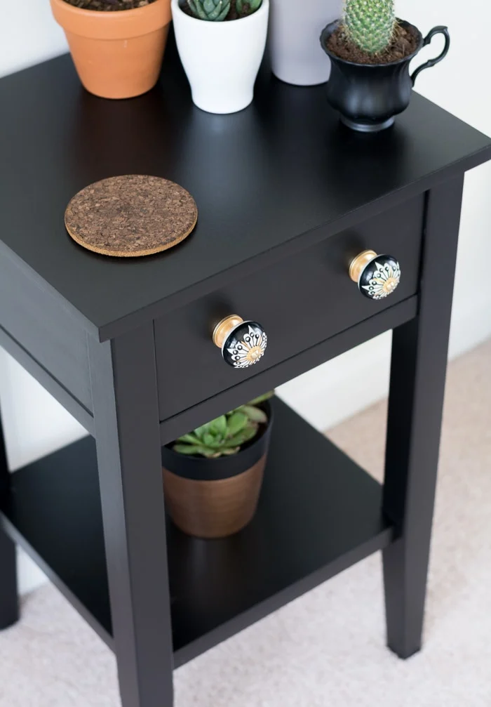 painted black nightstand with new knobs