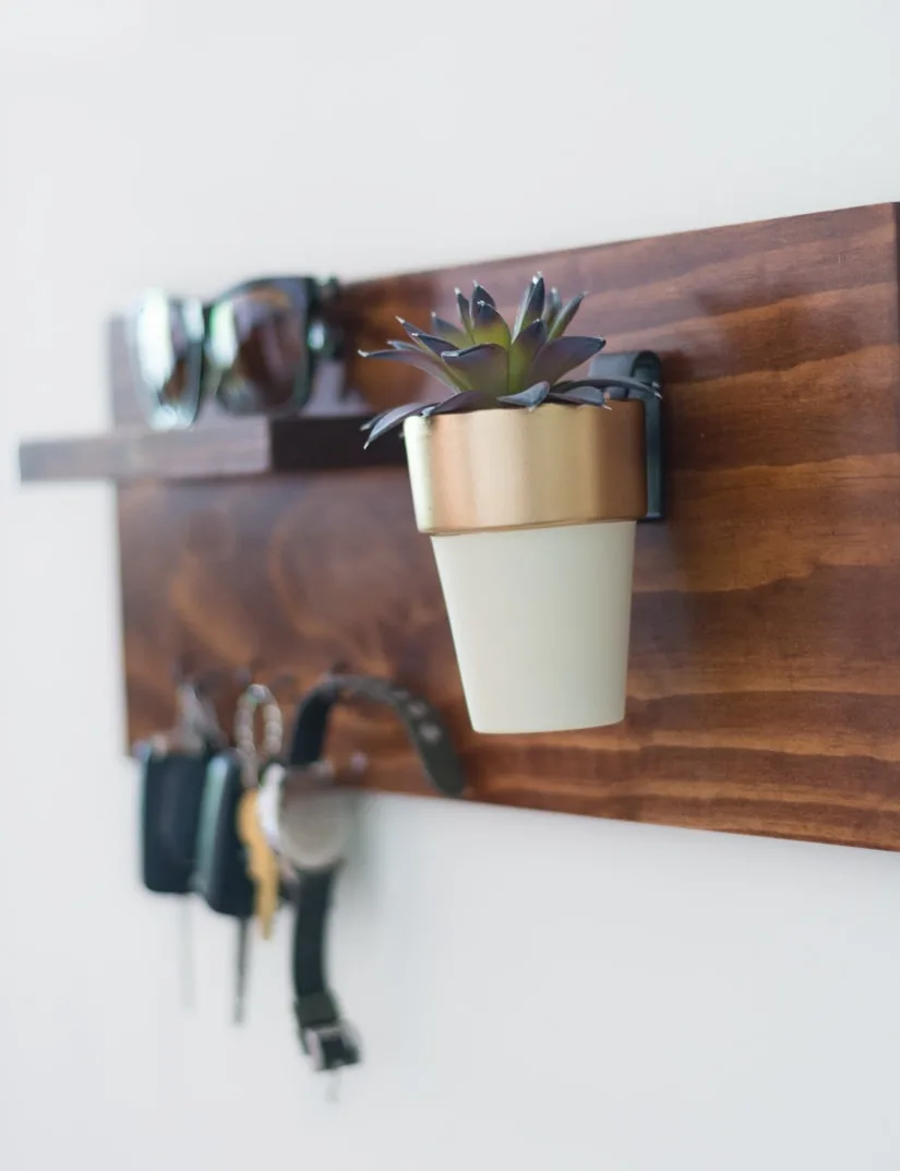 faux succulent hanging on a key rack