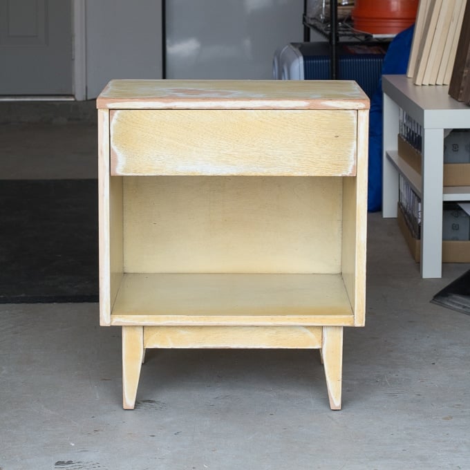 sanding the finish off on a piece of furniture