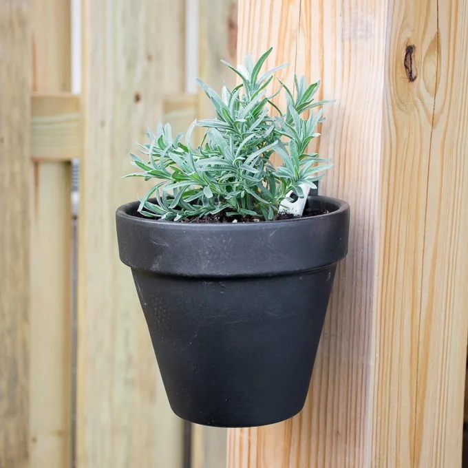 hanging painted pot on a deck post
