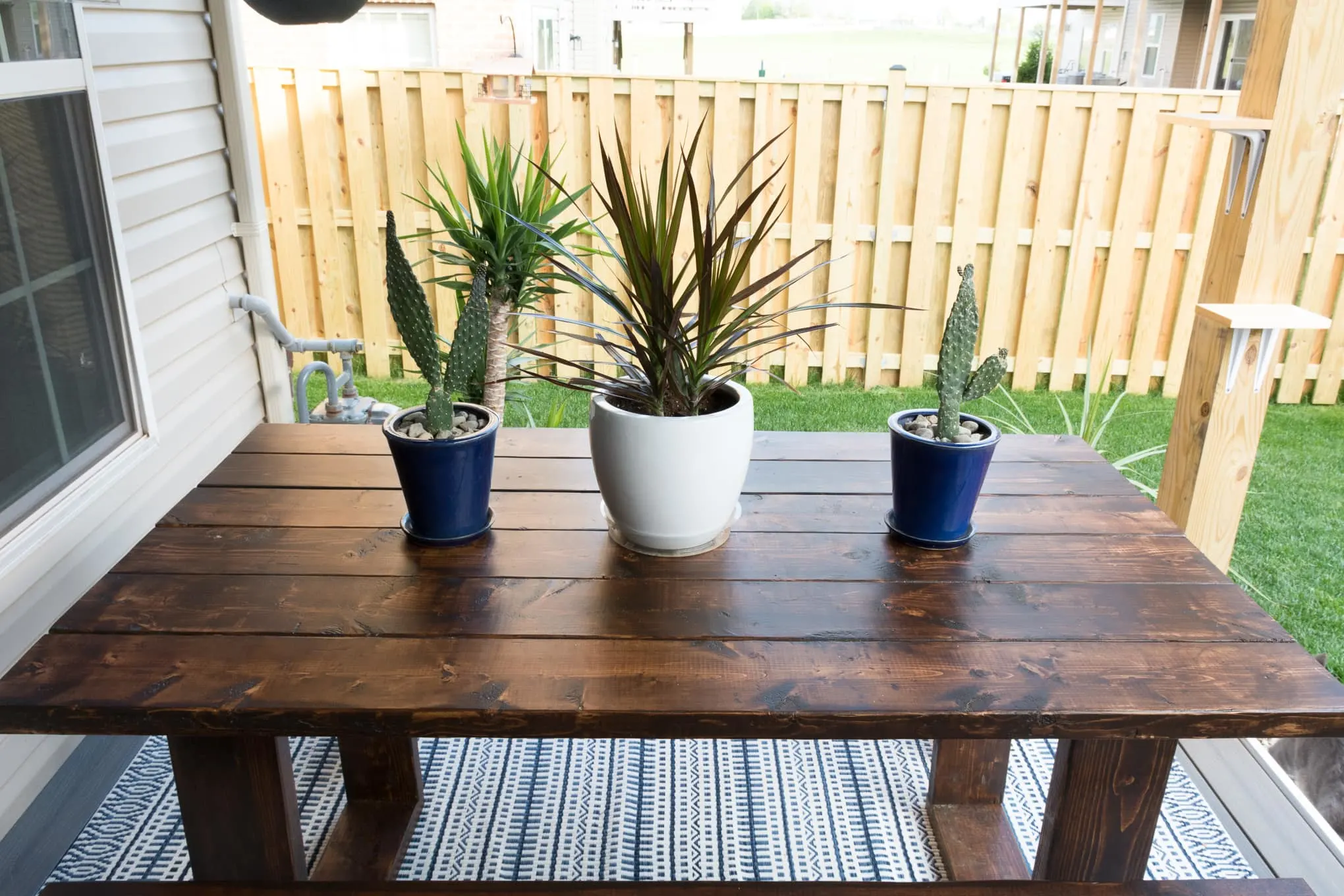 wooden table with blue and white pots