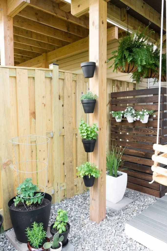 hanging terracotta pots on a deck post