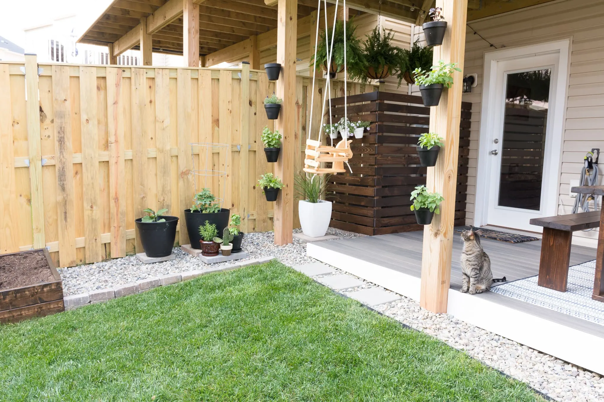 tiny backyard with a deck and plants