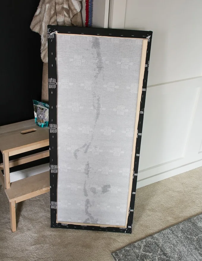 stapling the fabric for the breaker box cover