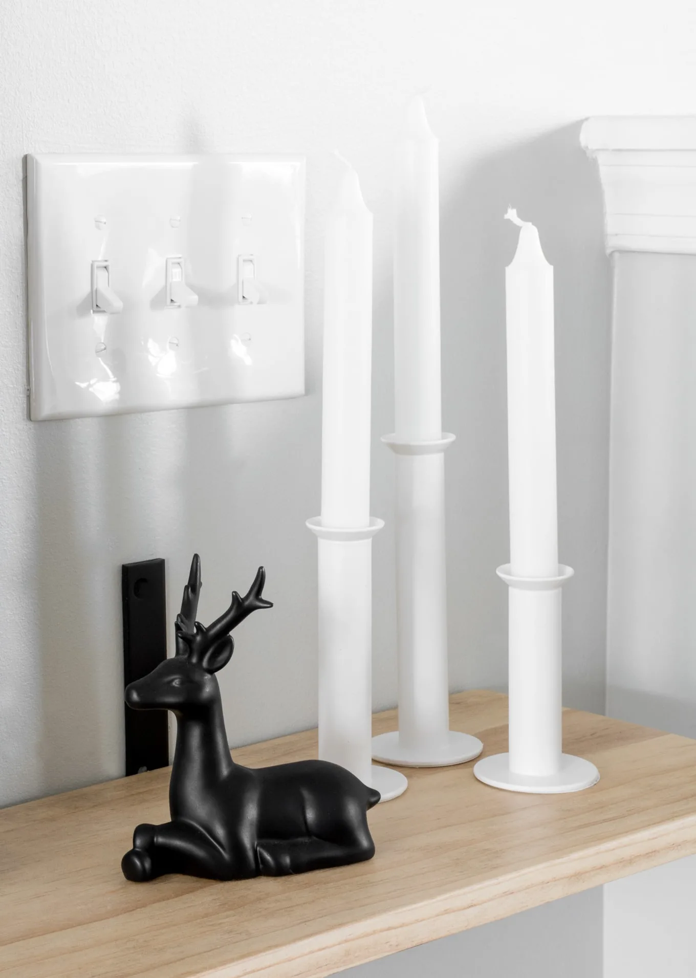 candlesticks and a deer figurine