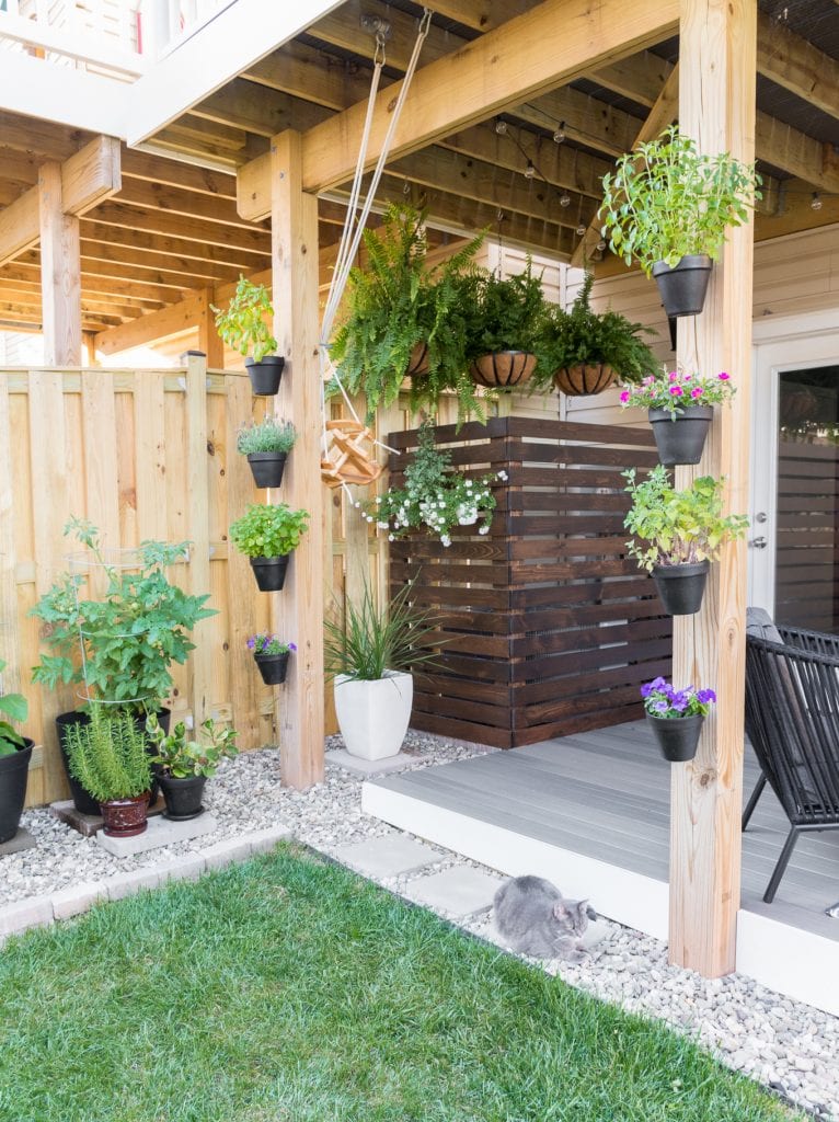 hanging terracotta pots on a deck post