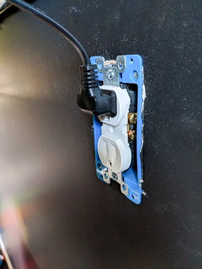 outlet to hide TV cords in a wall