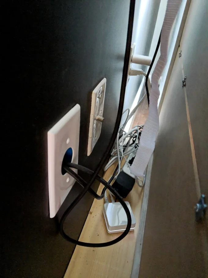 outlet to hide TV cords in a wall