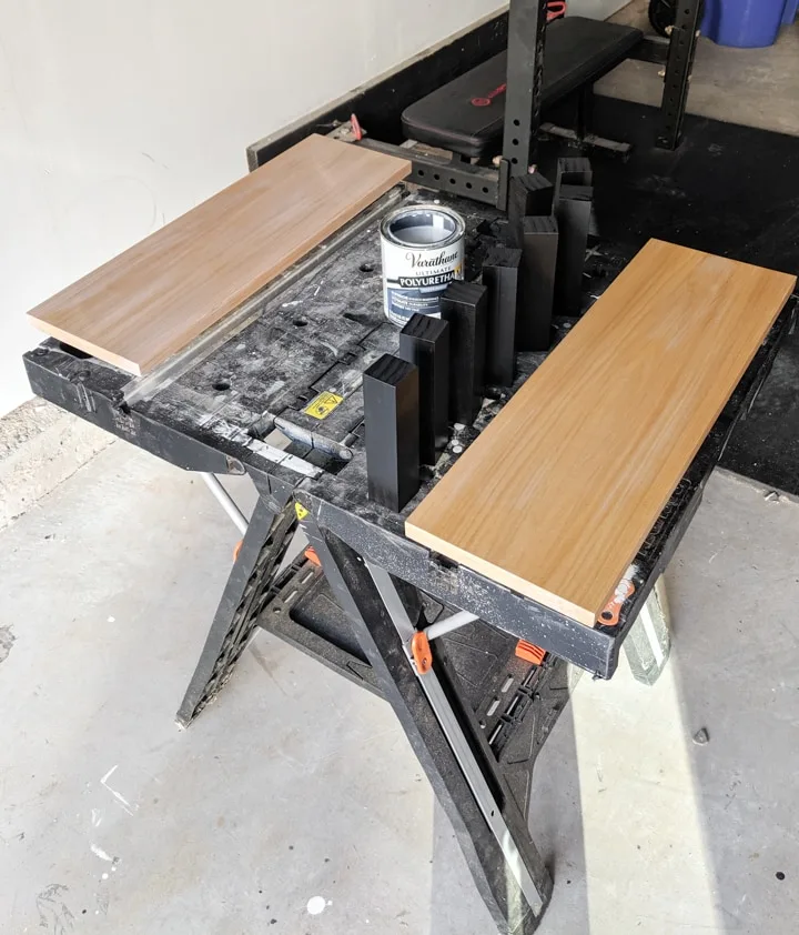 spray painting the shelving for the stands