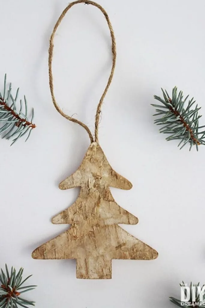Christmas tree shaped ornament made from birch with jute string for hanging