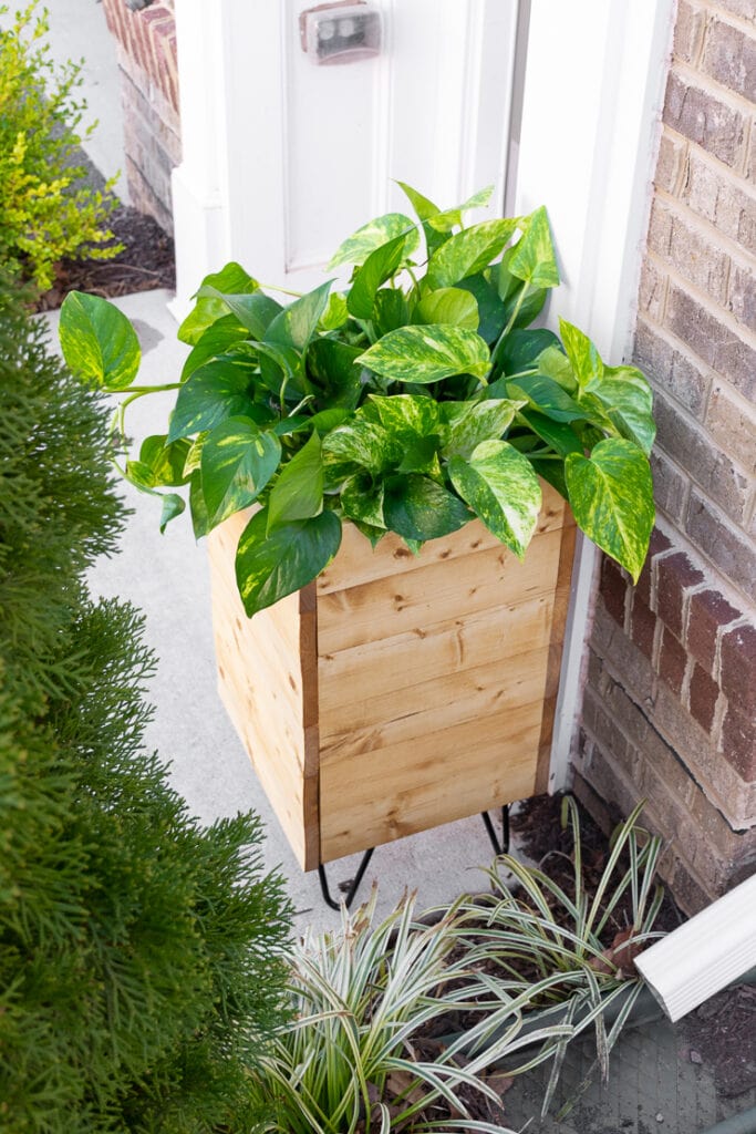 How to make a DIY planter box with hidden hose storage