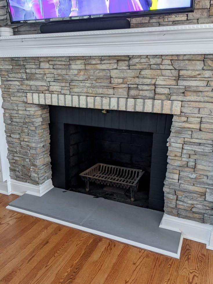 See how I made over an ugly, clunky stone veneer fireplace with paint!