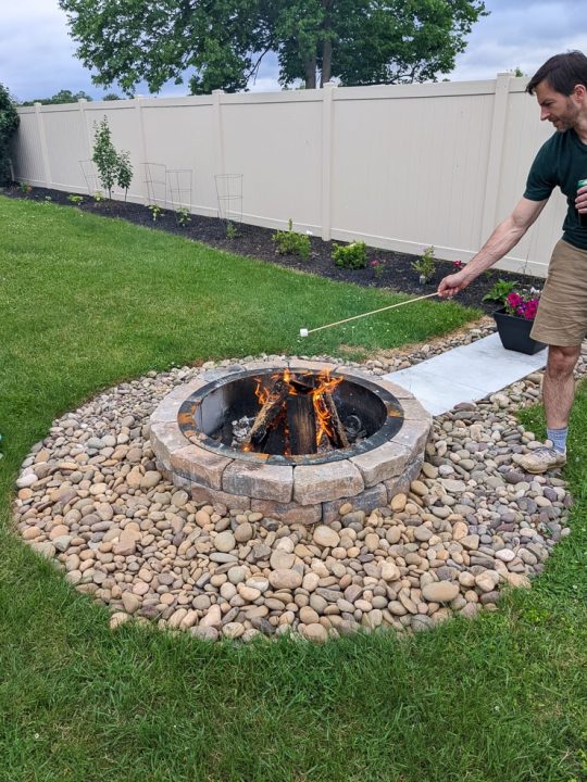 man roasting a marshmallow