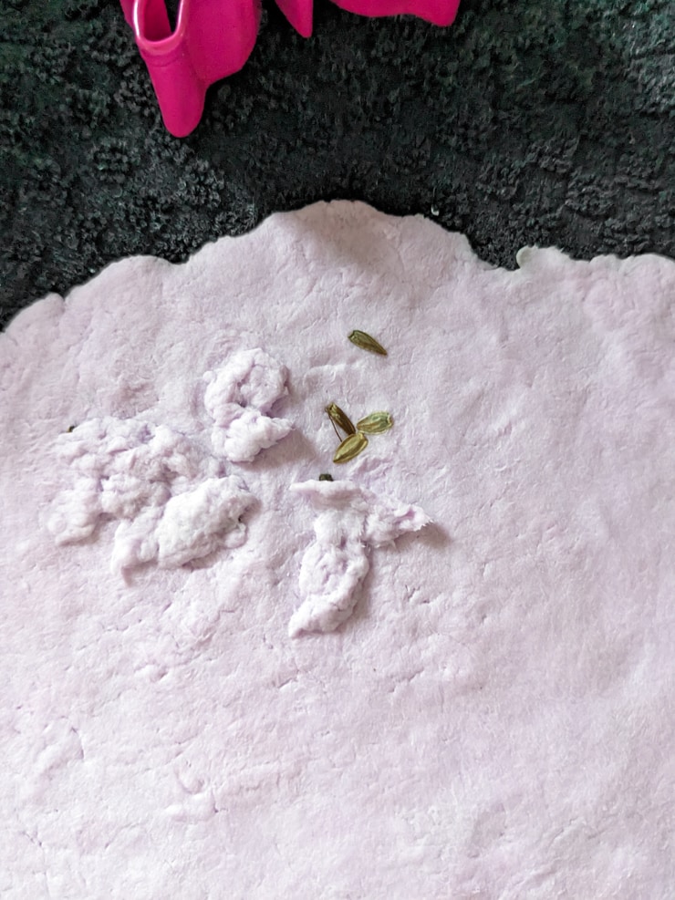 adding seeds to plantable seed paper mix