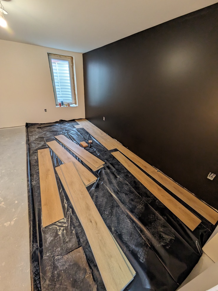 laying flooret vinyl plank flooring in a basement