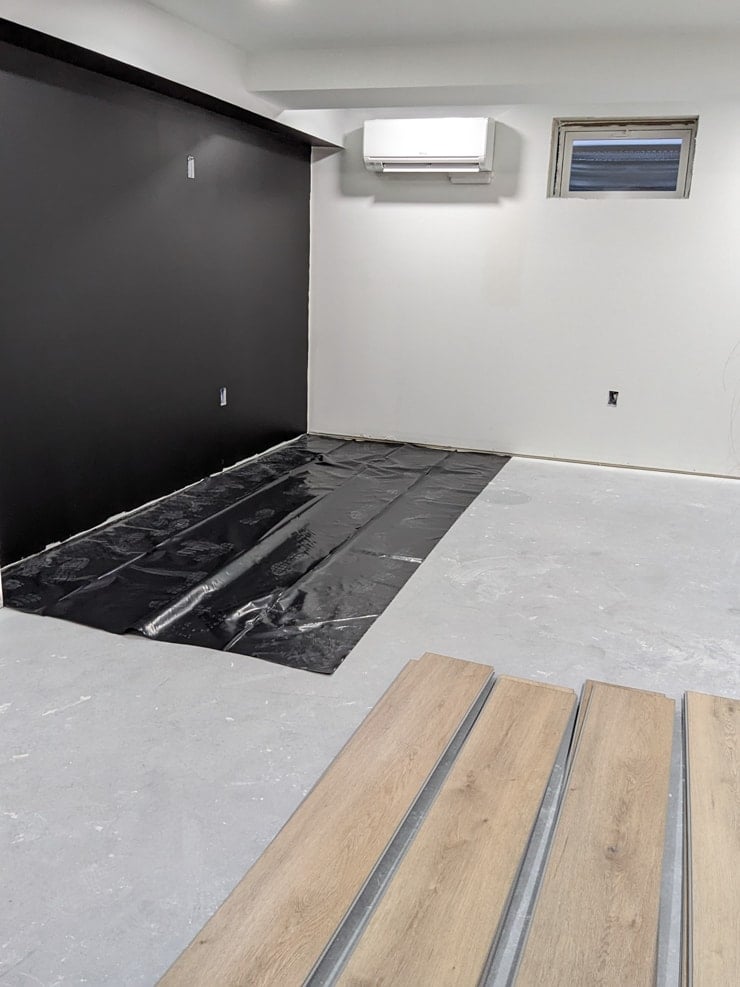 laying out a moisture barrier for vinyl plank flooring