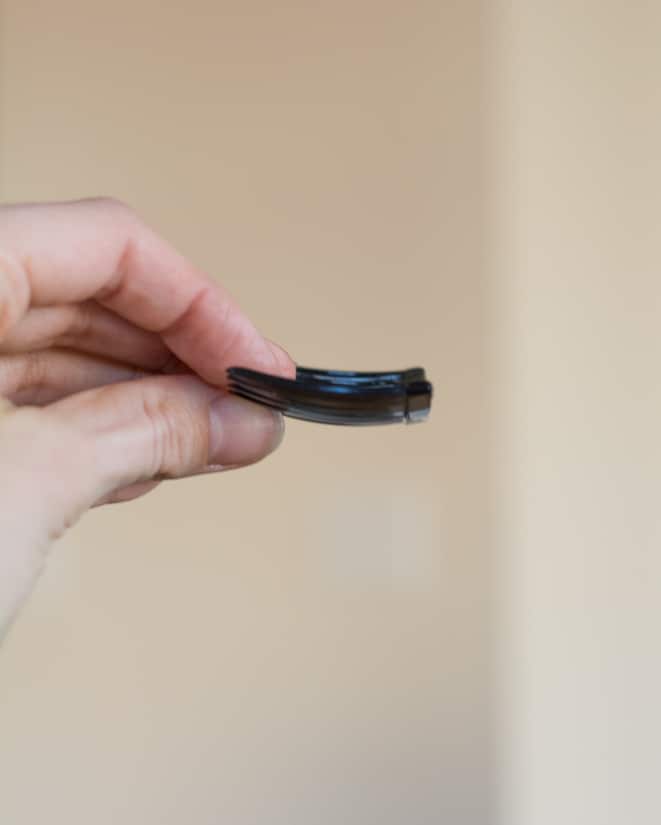 hand holding a comb