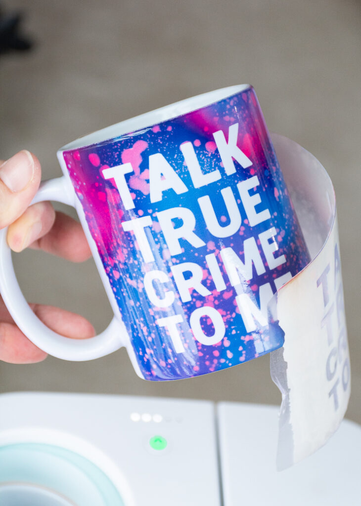 removing an Infusible Ink transfer sheet from a mug