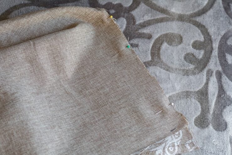 pinning the fabric to hem the bottom