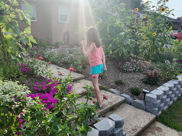 girl walking in a garden