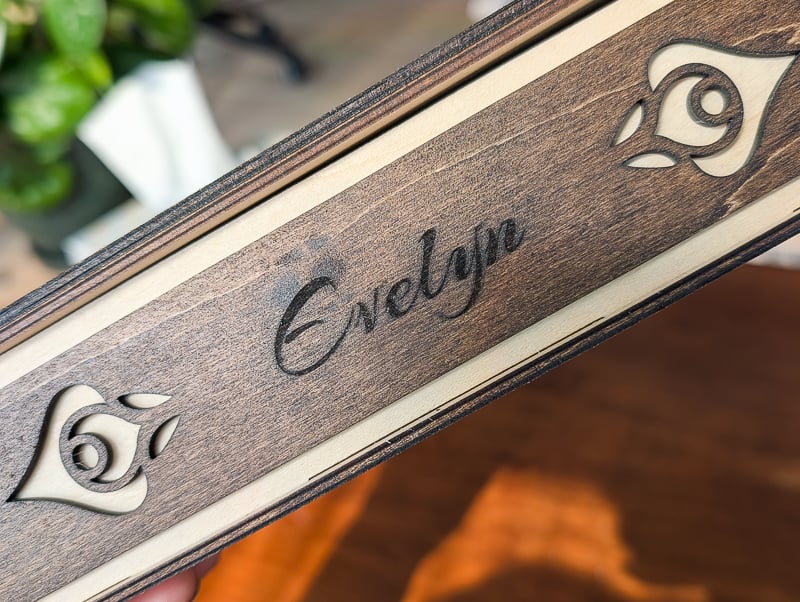 wood engraved with the name evelyn